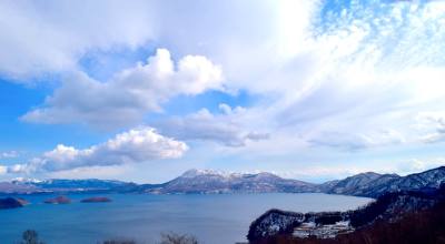 Lake Toya volcanic caldera Hokkaido Japan — Usu-zan active volcano crater and lakeside onsen ryokan
