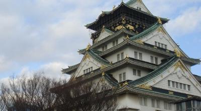 Osaka Dotonbori canal night Japan — Glico running man sign takoyaki kushikatsu street food neon